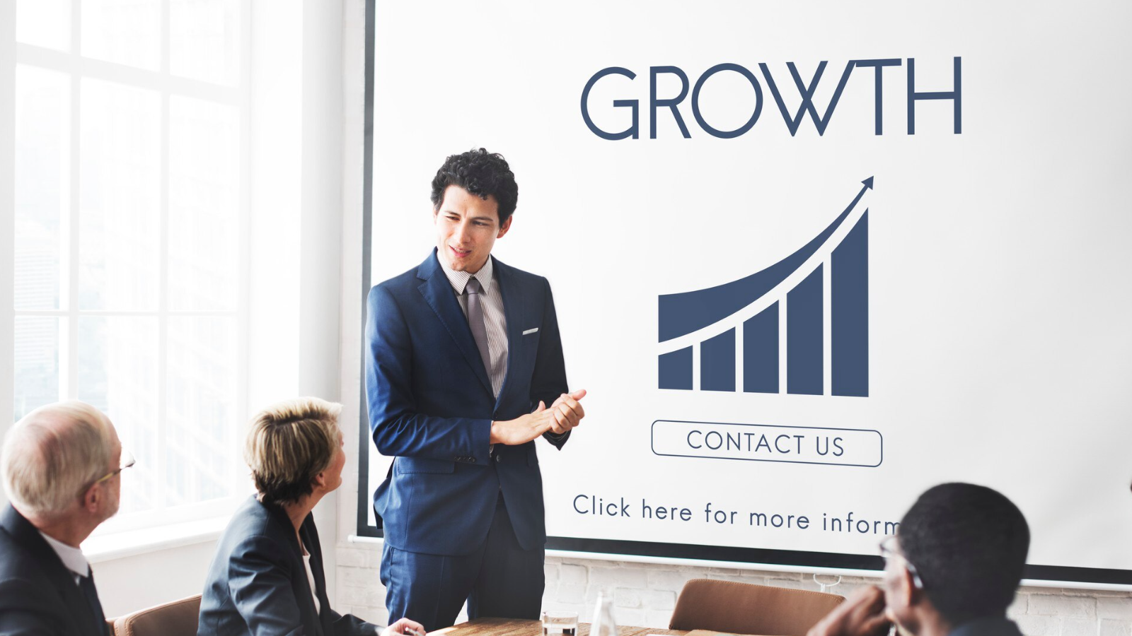 Man presenting company growth due to easy scaling with unified communications solutions.