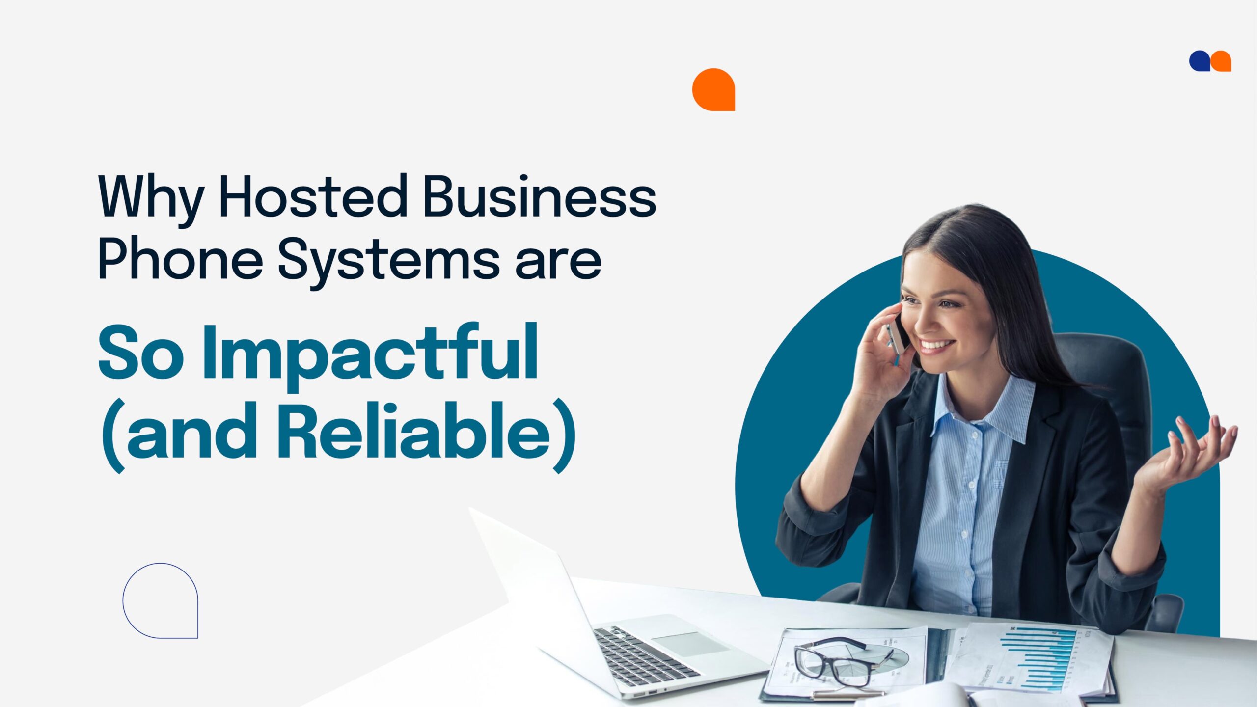 Businesswoman on a mobile phone at her desk, highlighting the benefits of a cloud-based phone system with video conferencing.